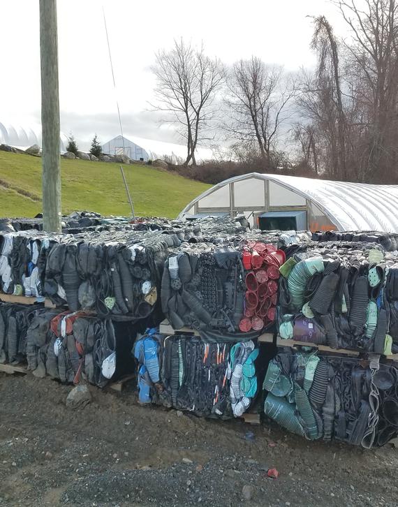 Recyclable containers bailed and ready to be shipped to the recycling facility.